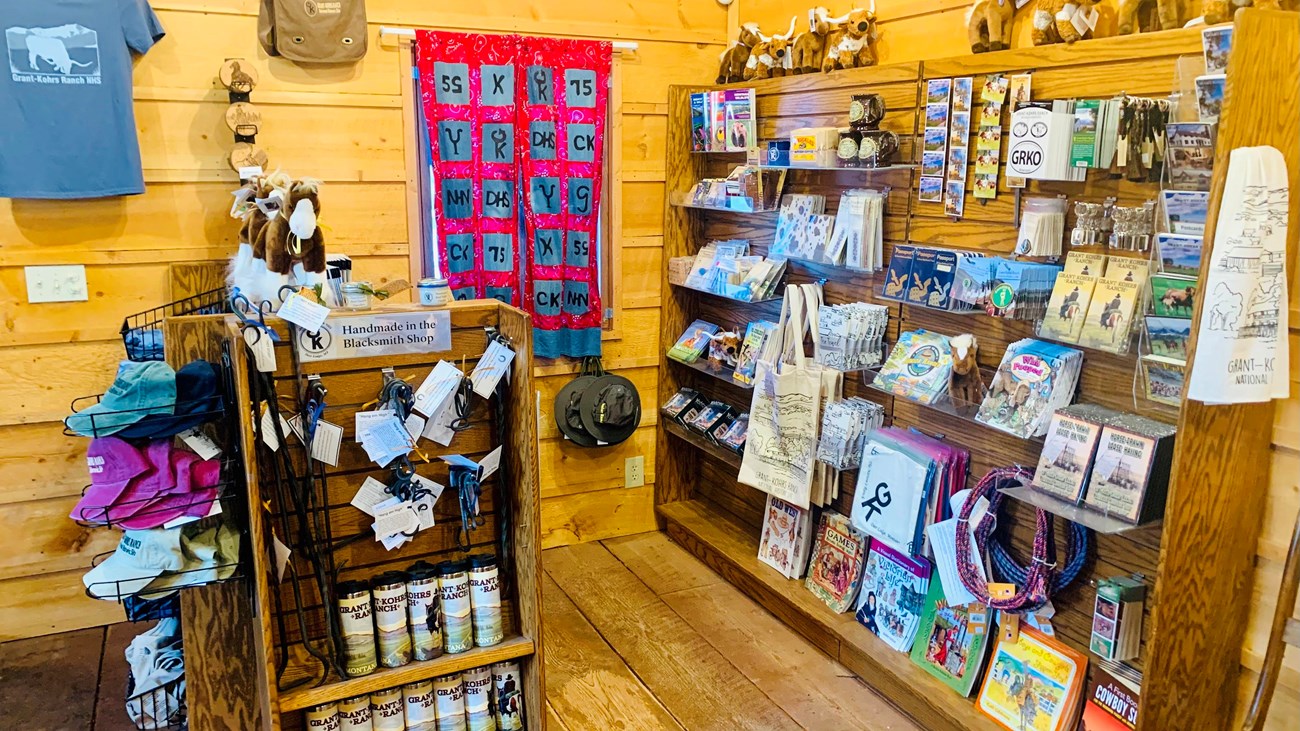 Inside view of the Grant-Kohrs Ranch park store. There are several items for sale on shelves.