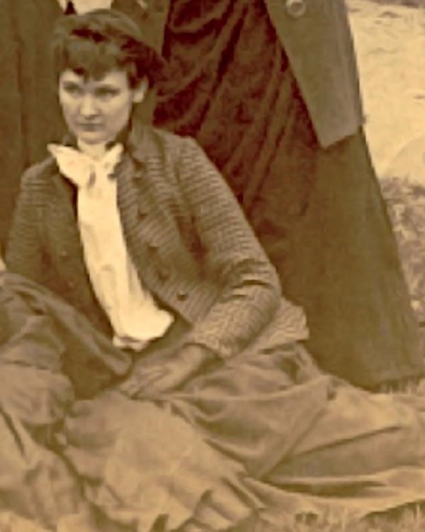 Georgia Elliott sitting on the lawn at Gallaudet College in 1888