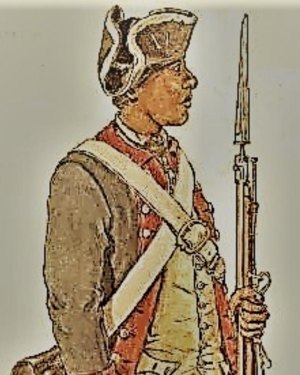 A man stands at attention in a Continental soldier's uniform. 