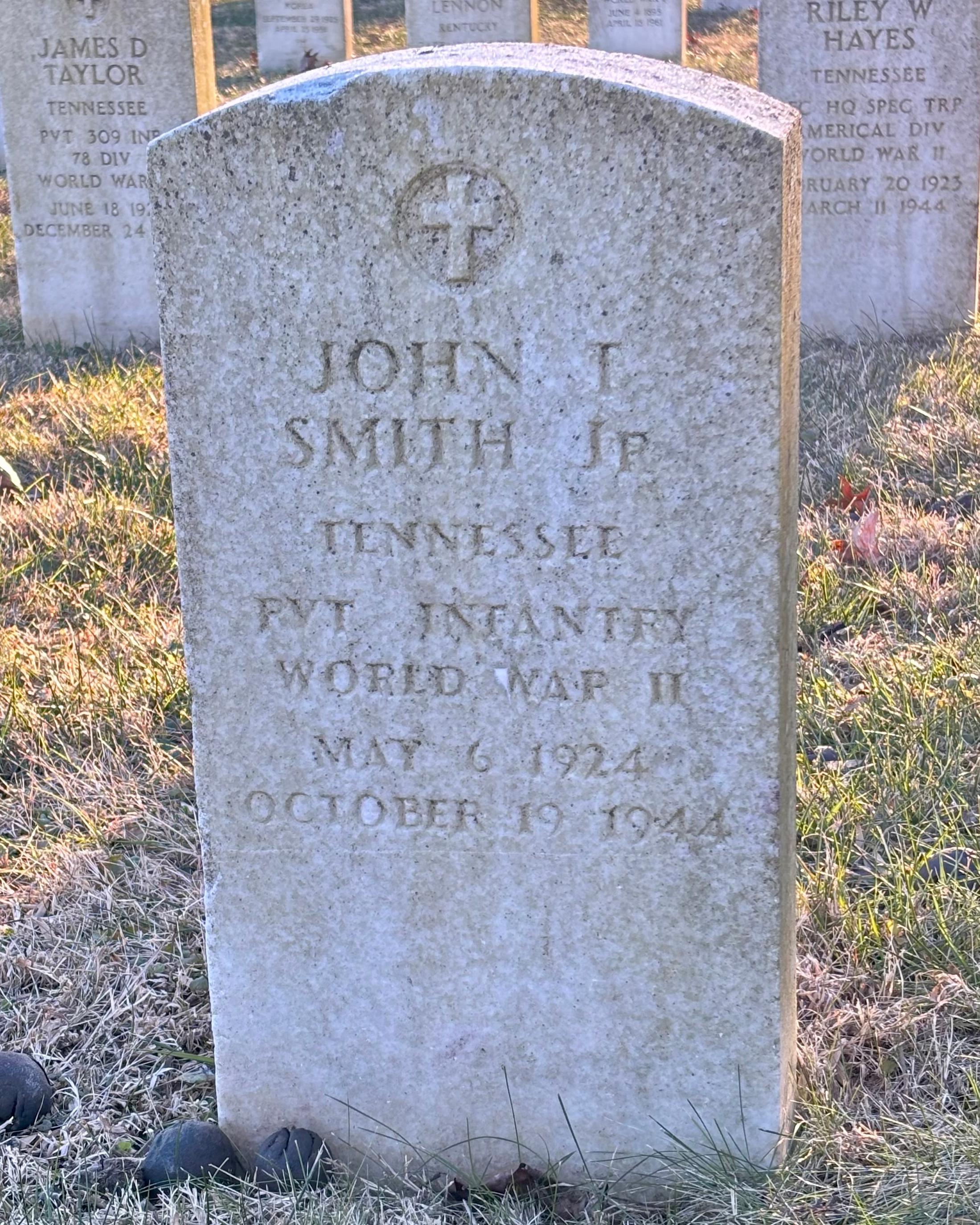 Headstone reading" John T Smith Jr Tennessee PVT Infantry WWII May 6, 1924 October 19 1944"