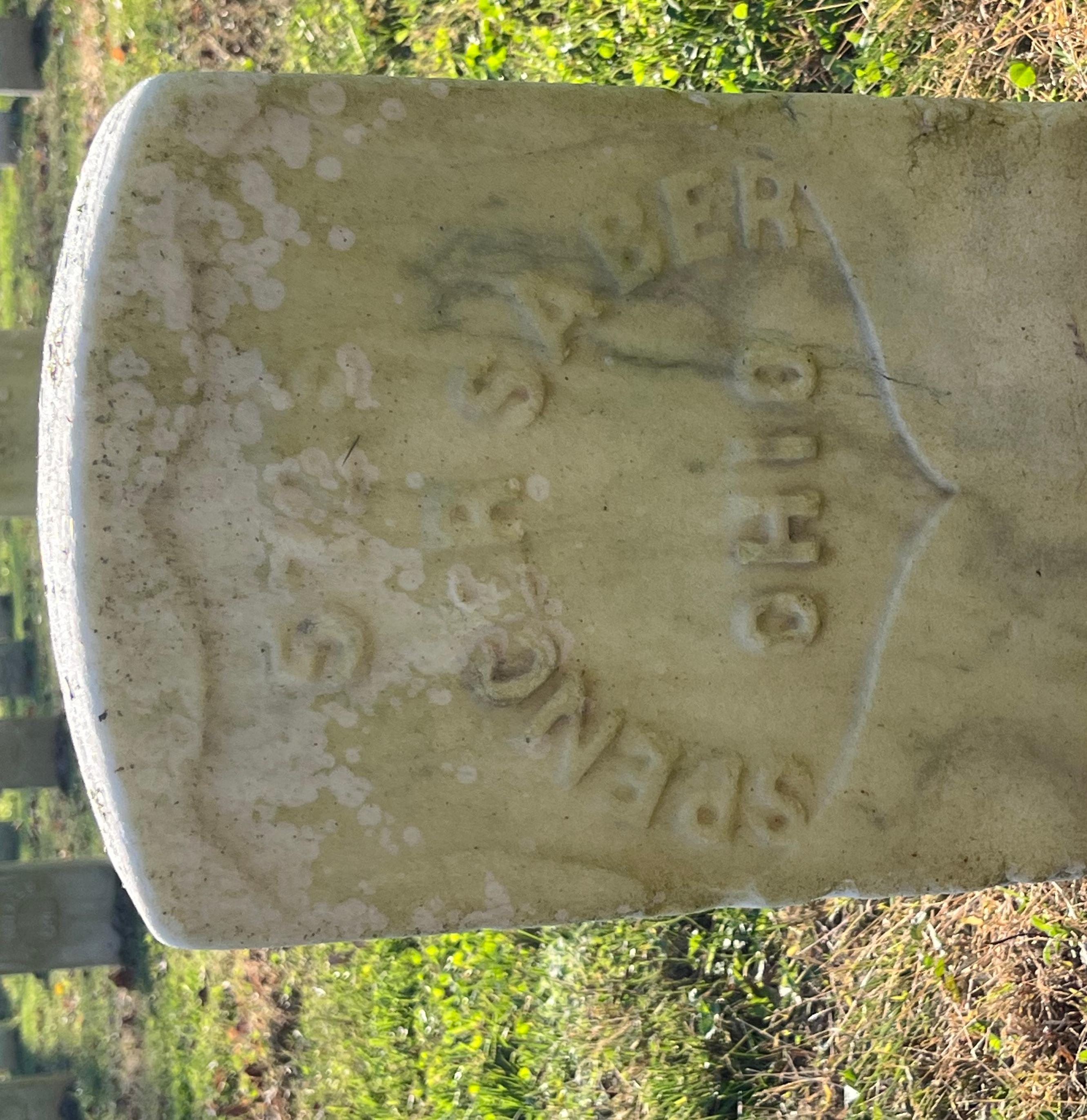 White marble headstone of Spencer Sober spelled Saber on the stone.