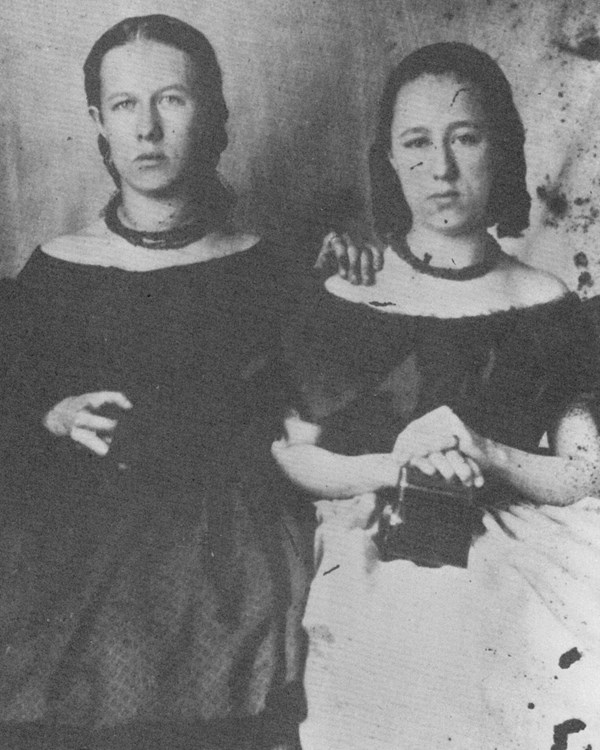 Lucy and Nellie Buck dressed in 19th century clothing