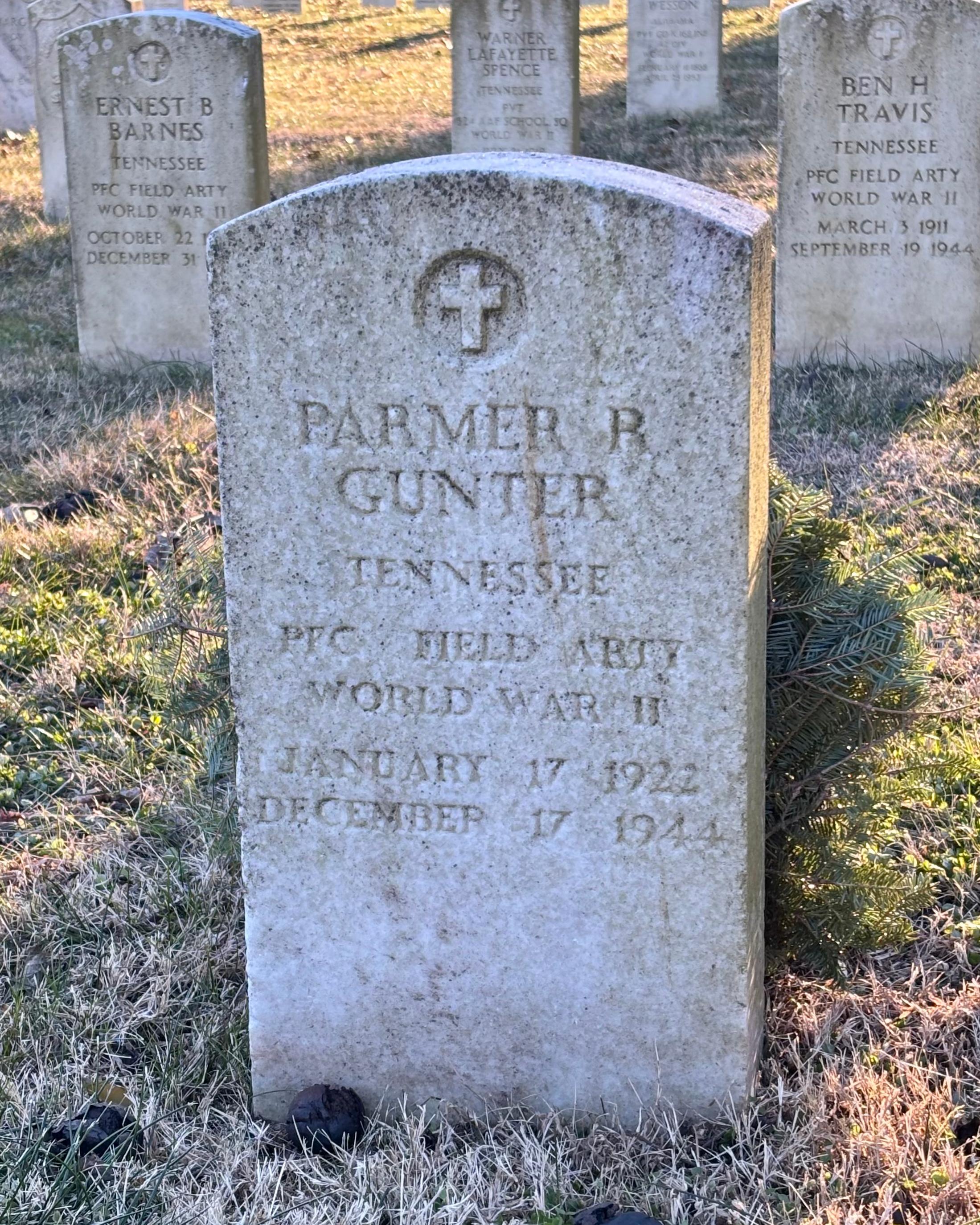Headstone reading "Parmer R Gunter Tennessee PFC Field ABTY WWII Jan 17 1922 Dec 17 1944