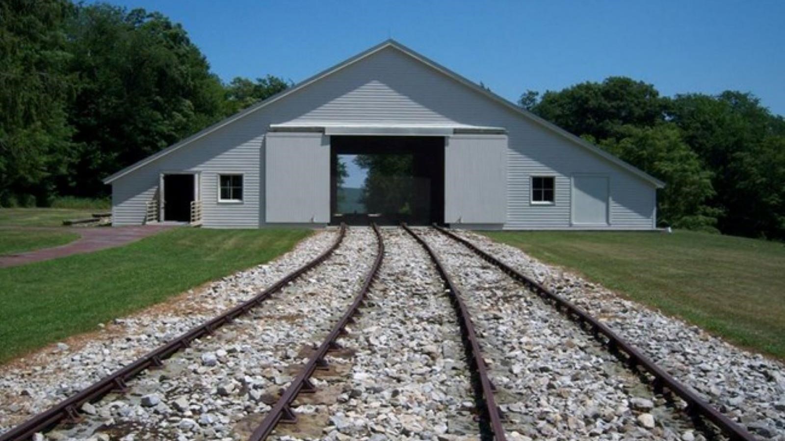 A white barn-like structure that housed the machinery needed to pull everything up the steep grades