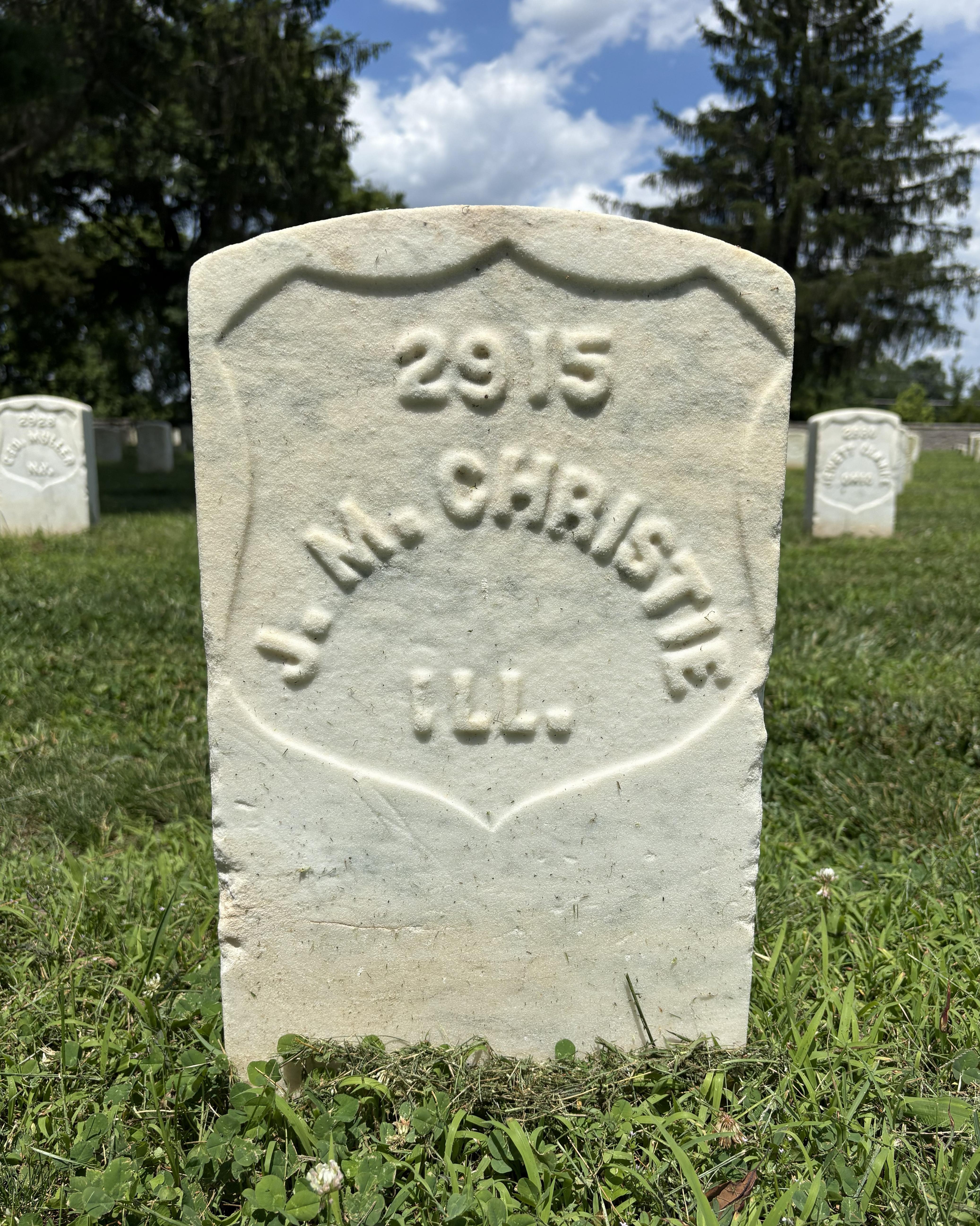 Marble headstone with the name "J. M. Christie" on it. 