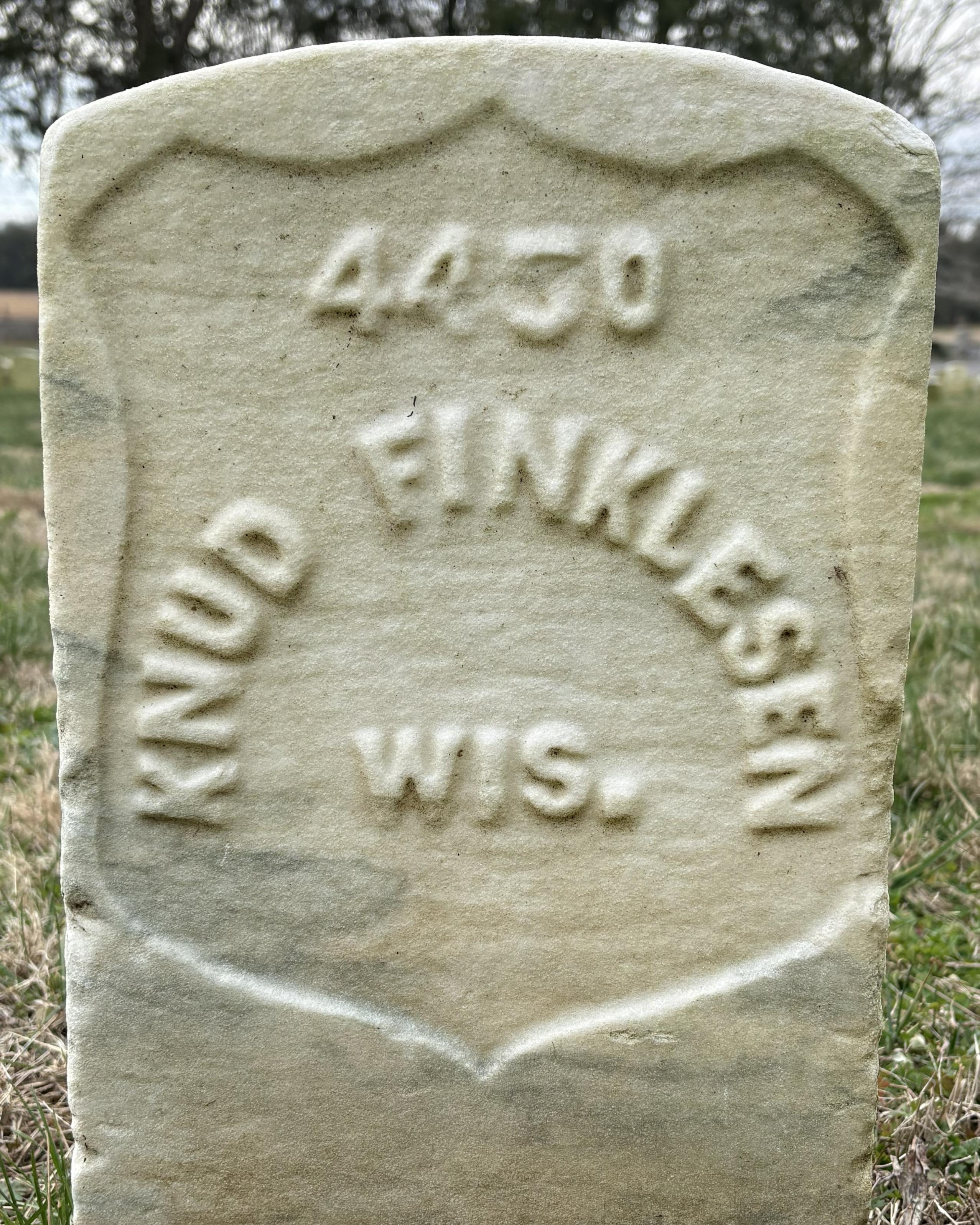 Marble headstone reading "Knud Finkelsen Wis." 