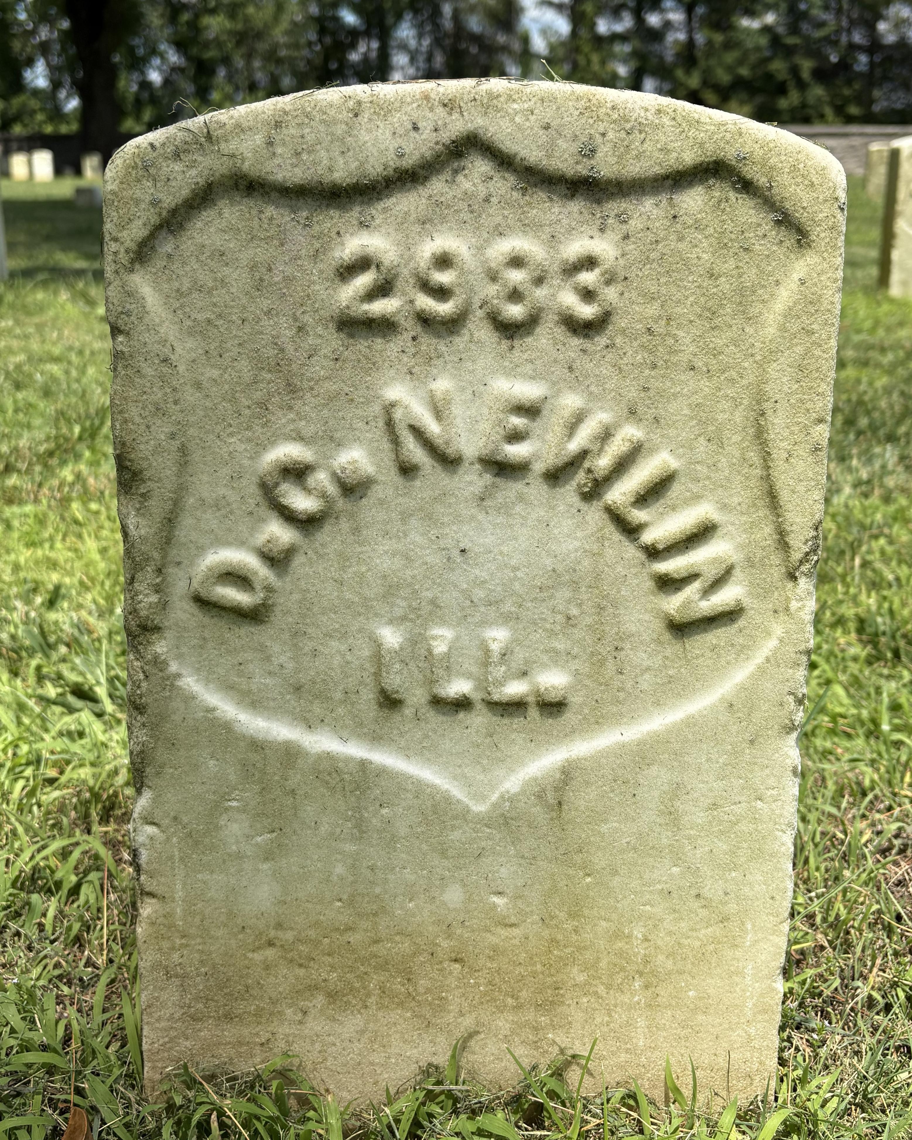 Marble headstone belonging to veteran of the 155th Illinois Infantry named David Newlin.