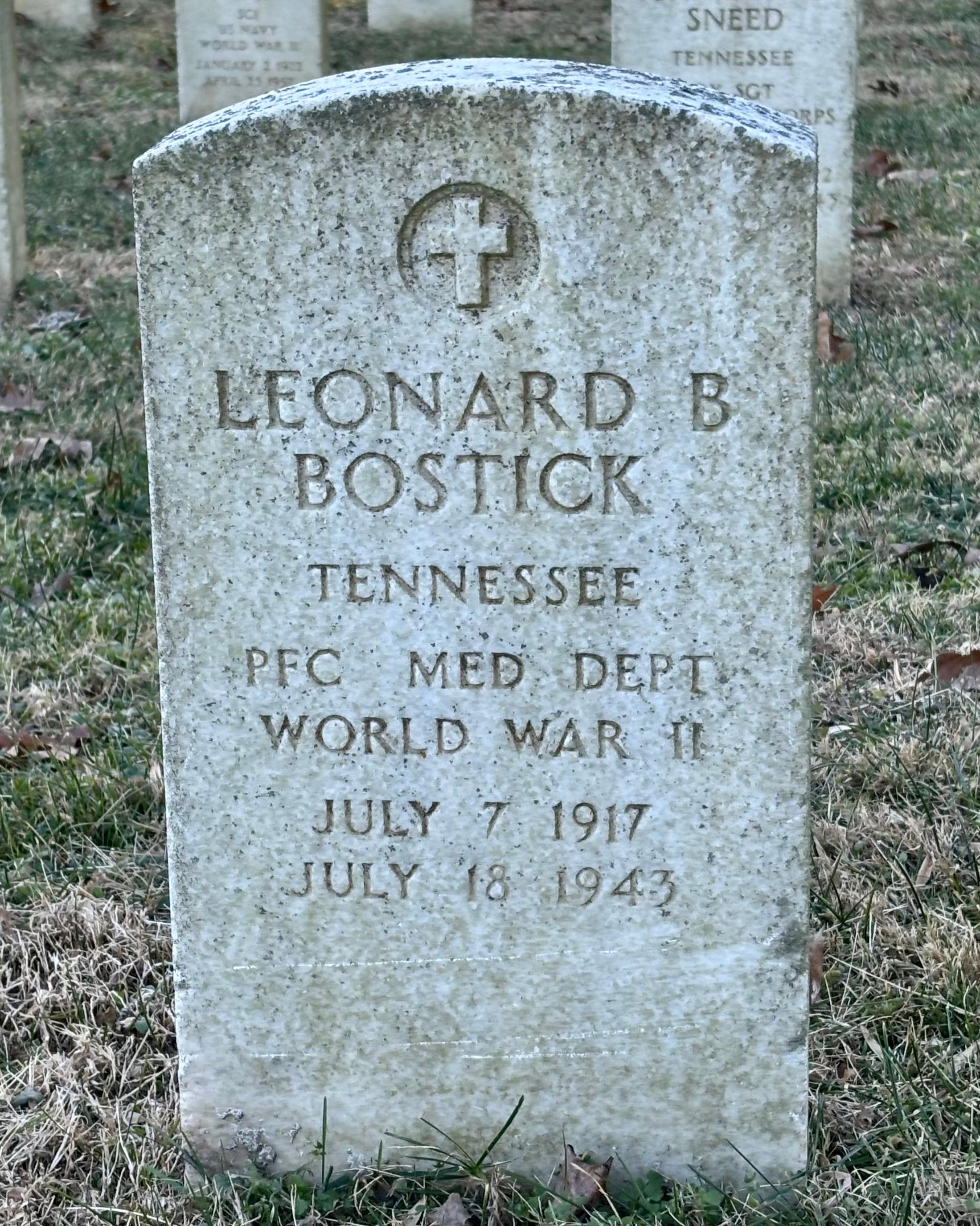 Headstone reading "Leonard B Bostick Tennessee PFC Med Dept WWII July 7 1917 July 18 1945"