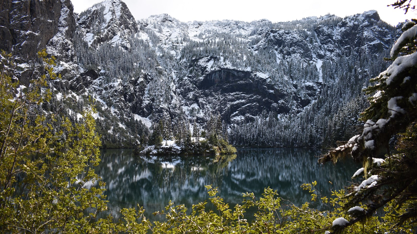 A mountain like with snow all around