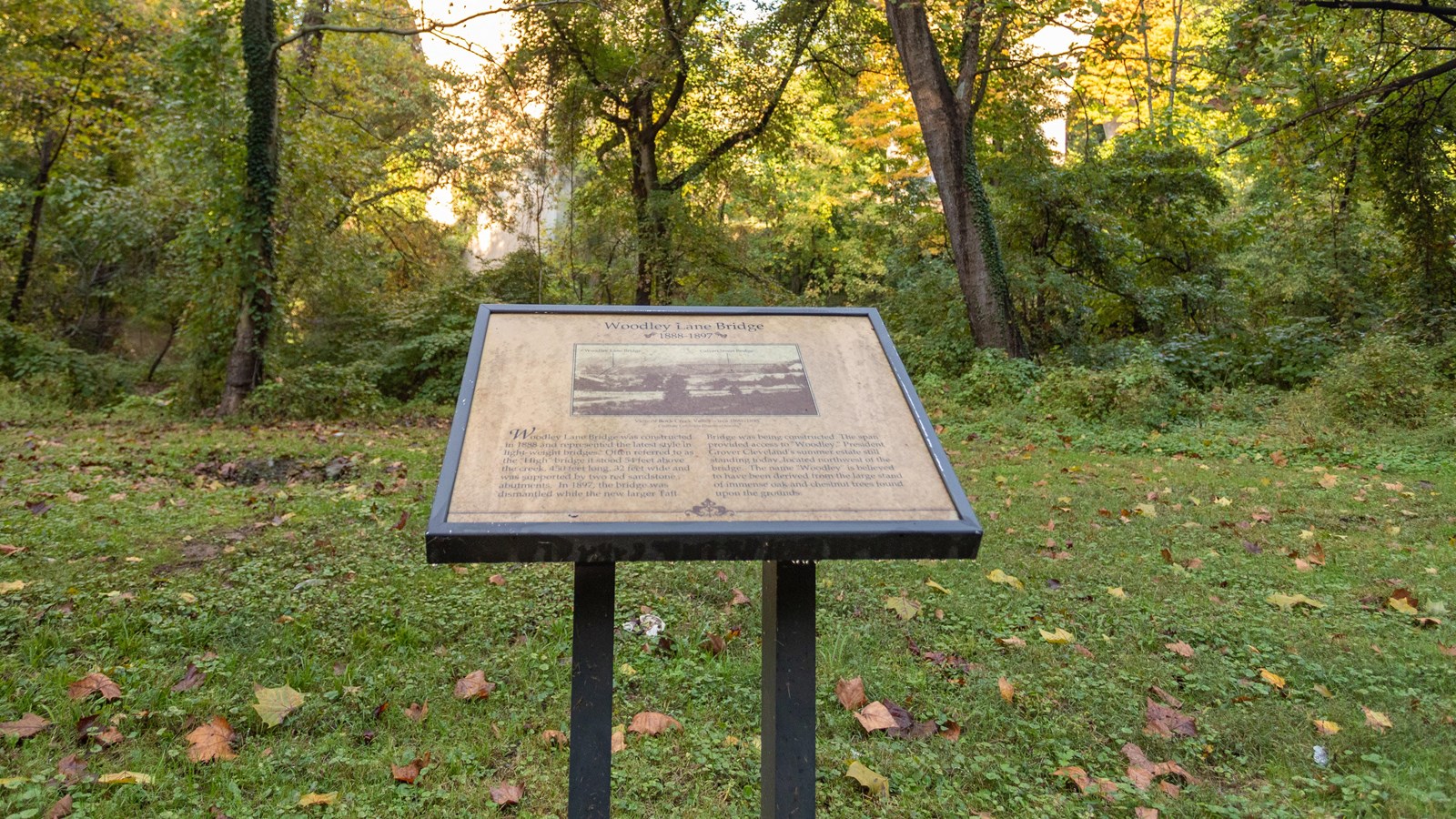 An information panel describes the former Woodley Lane Bridge at this location.
