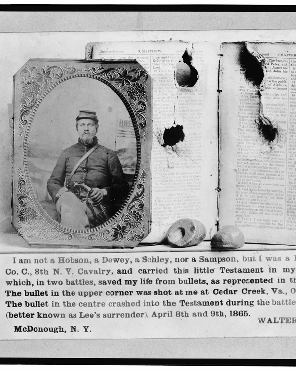 Photo of a man and his bible that saved his life twice