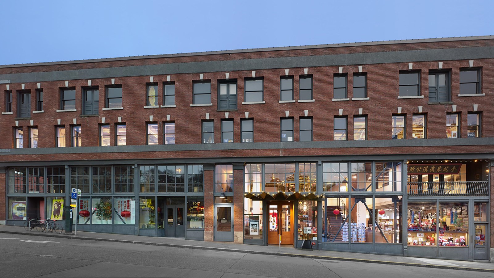 The building in this photograph is a three-story structure with a red brick façade.