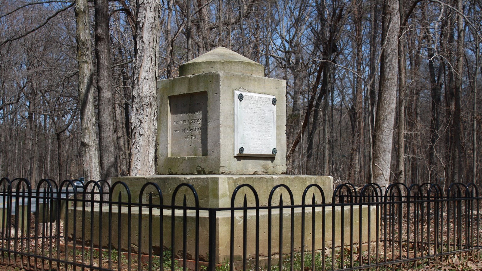 A multi layered cenotaph. The monument appears as a square stone atop multiple layers of a base.