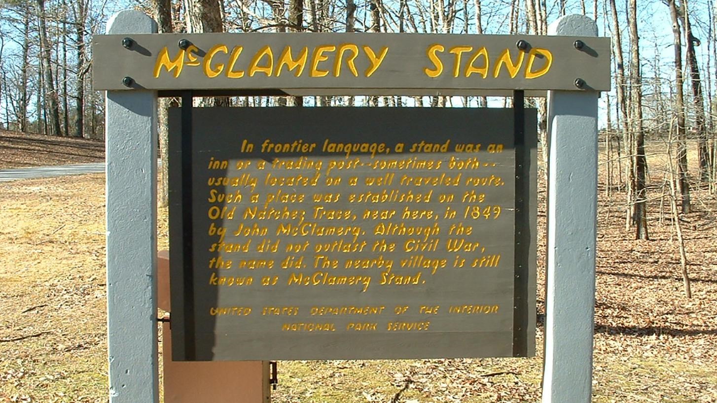 Brown sign with yellow letters entitled