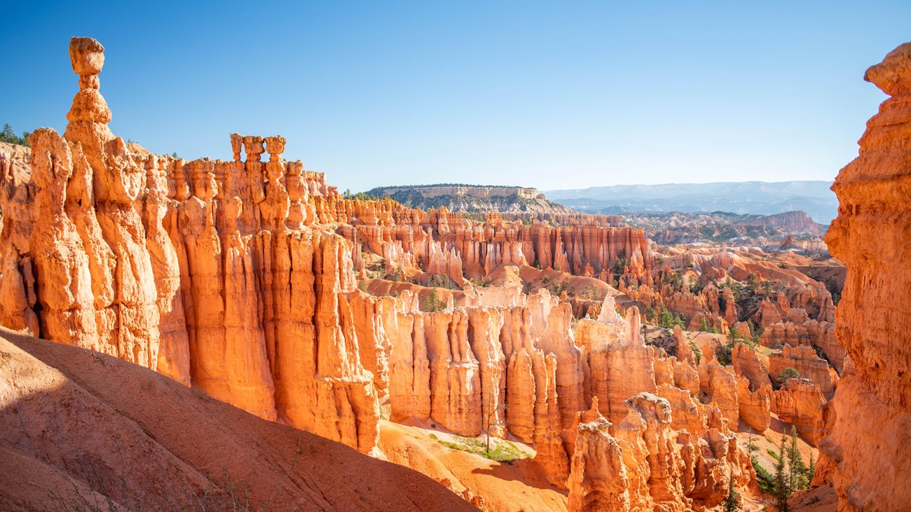 Red rock formations against a clear blue sky