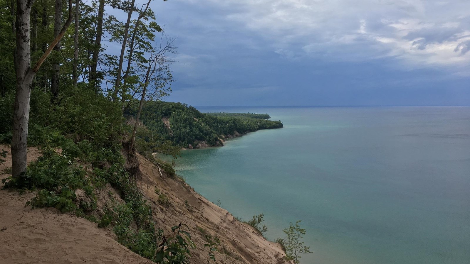 At the Log Slide looking west at dark clouds over Lake Superior, and the Grand Sable Dunes.