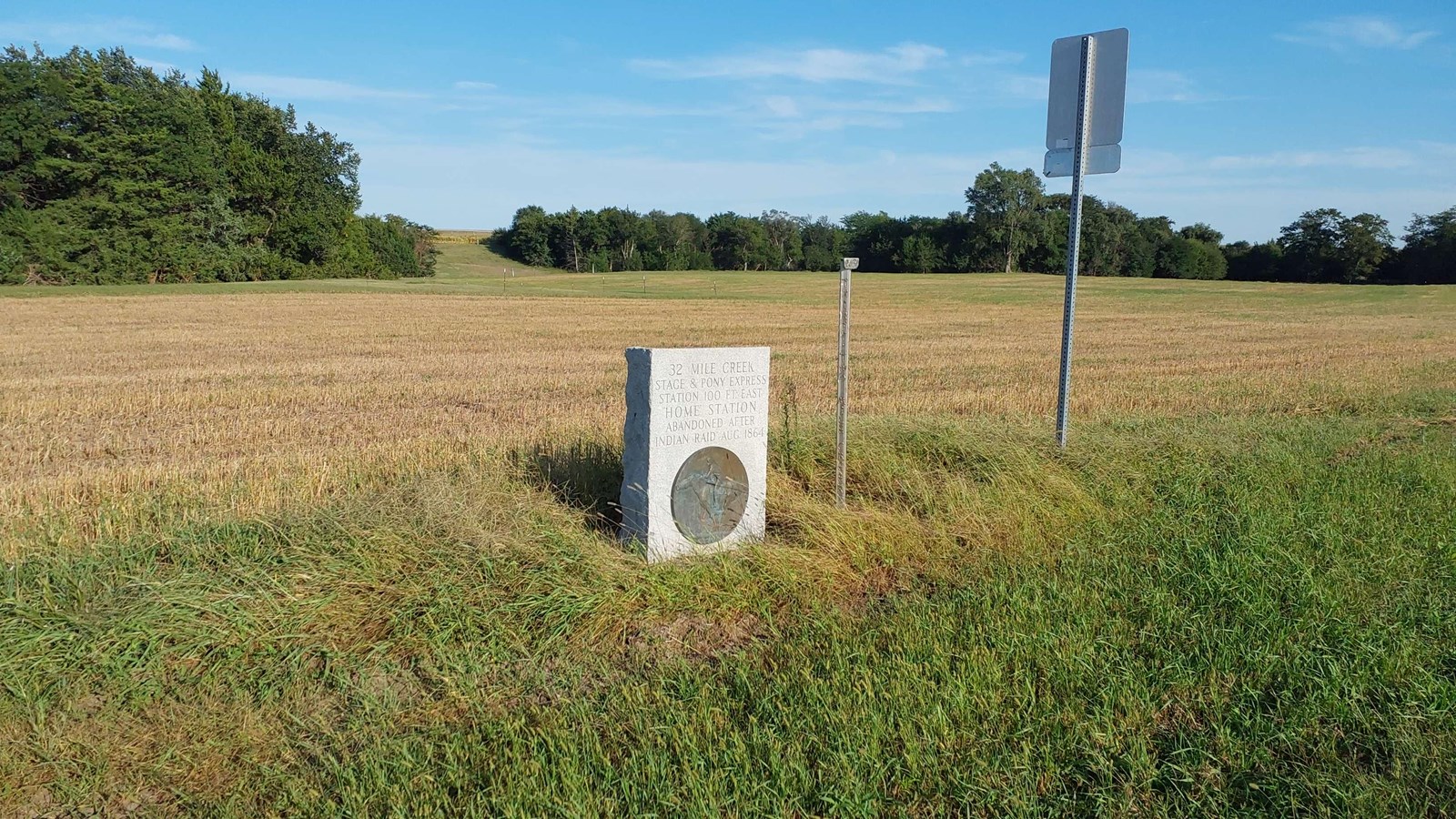 A stone marker says, 