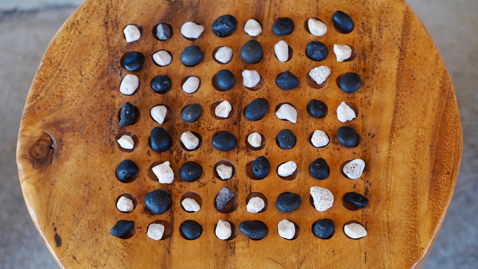 A game board of Kōnane, or Hawaiian checkers, at Puʻukoholā Visitor Center