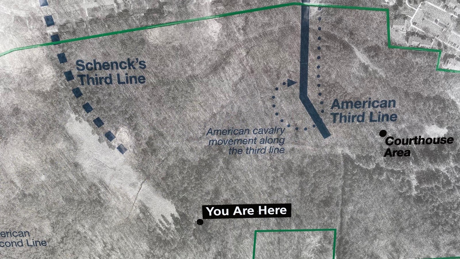A satellite image depicts where the third line was once thought to be, and the true location today.