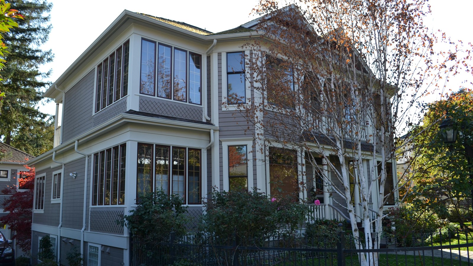 Two-story house with many windows. 