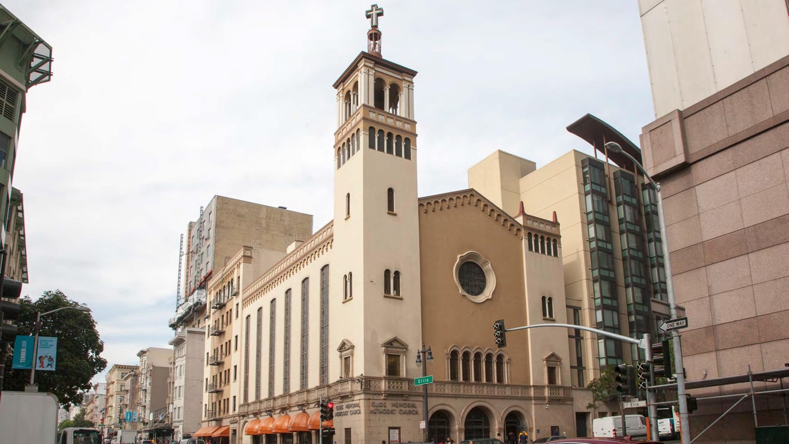 Tall, sand-colored church with a tower on a San Francisco corner