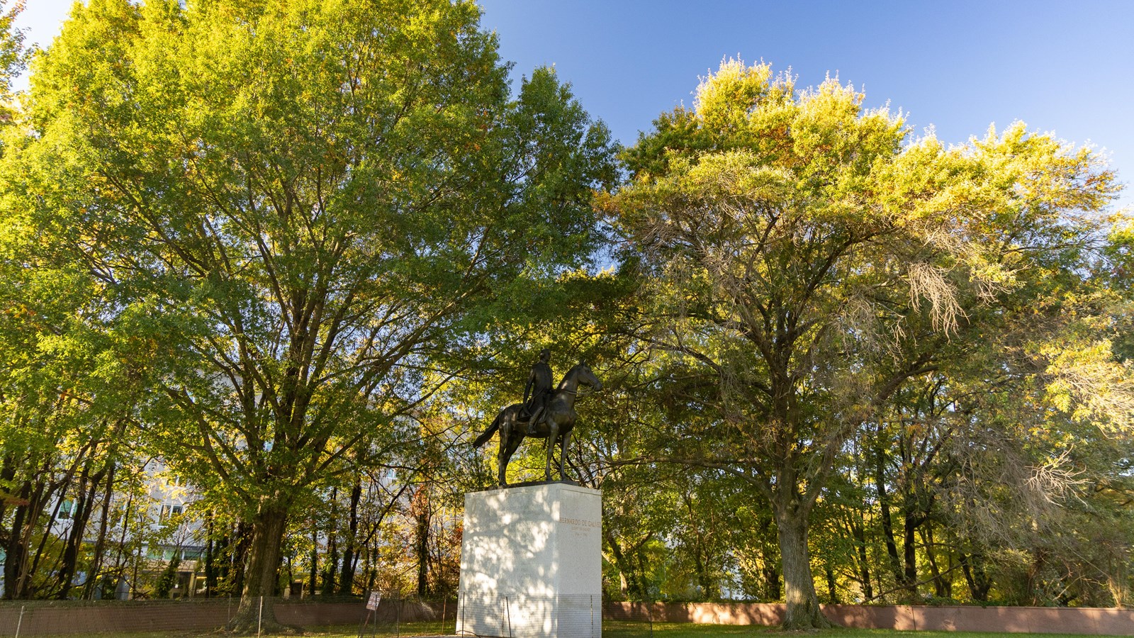 A large statue of a man on a large horse