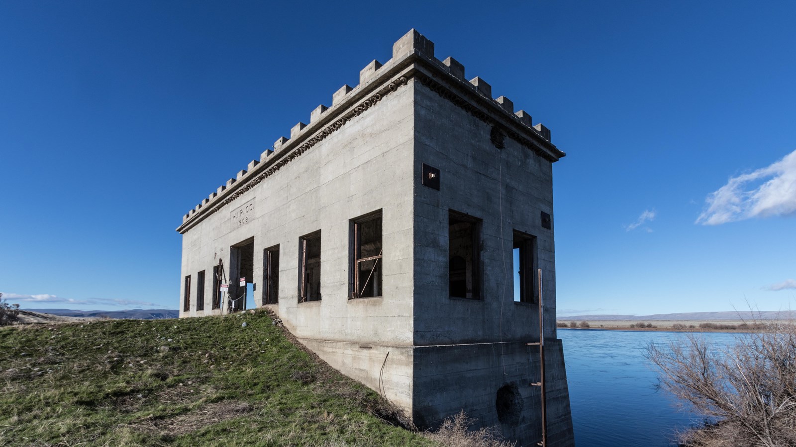 color photograph of an imposing masonry structure viewed from the side