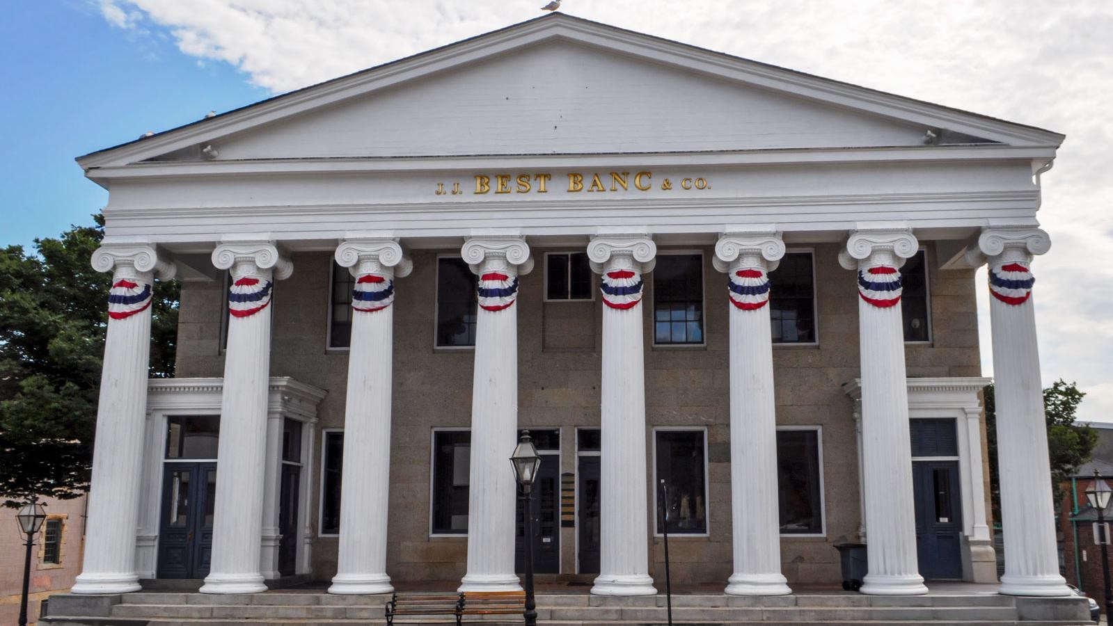 The Double Bank Building in New Bedford, featuring eight tall Ionic columns and a triangular pedimen