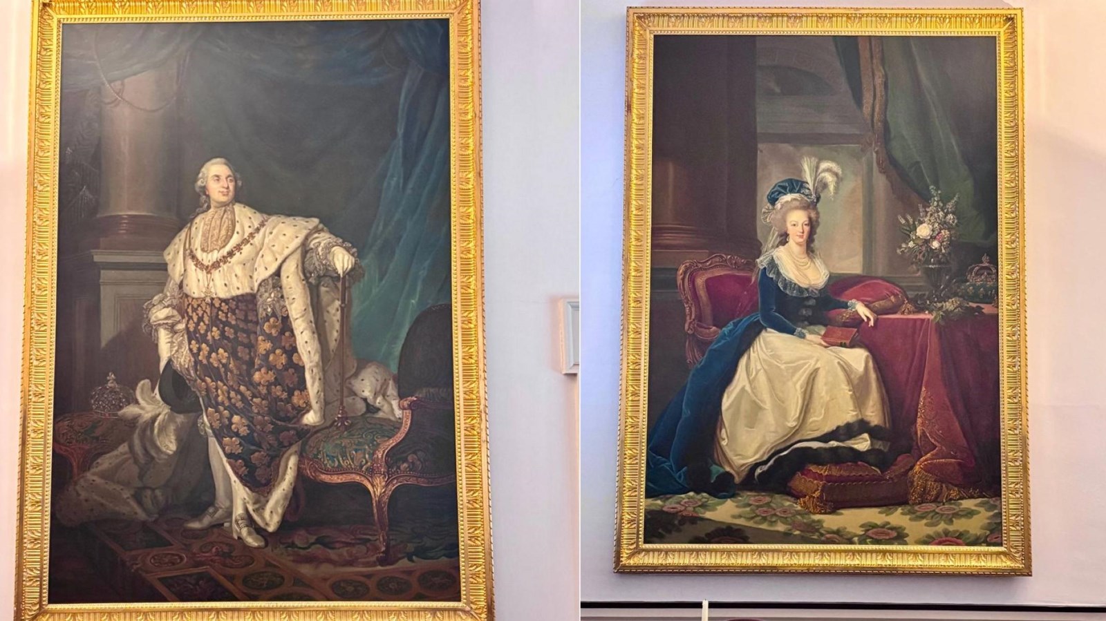 Two large portraits of a man and woman in gold frames