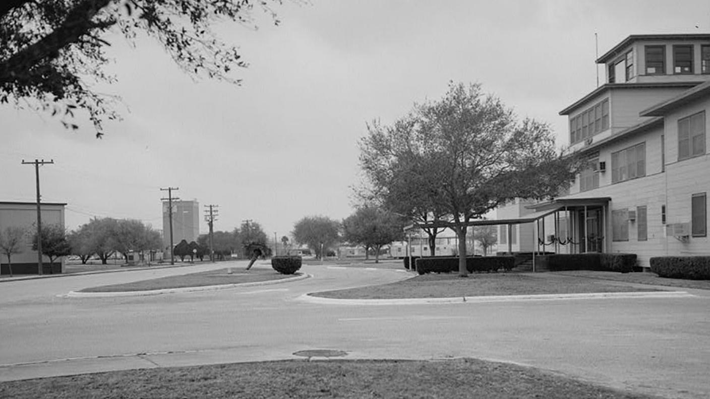 A Naval Air Station at the corner of two streets.