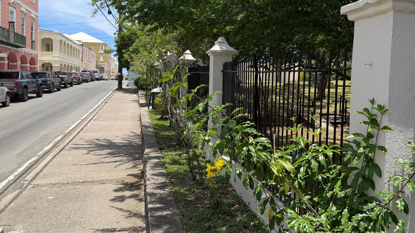 A view down King St with wrought iron fence and archways