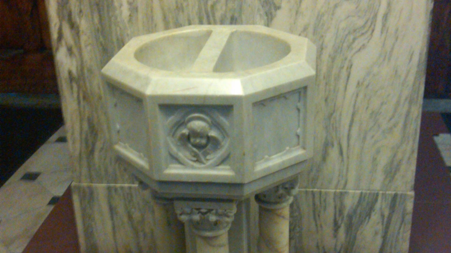 stone basin on pedestal on tiled floor