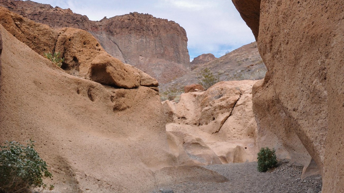 A trail winds through a canyon