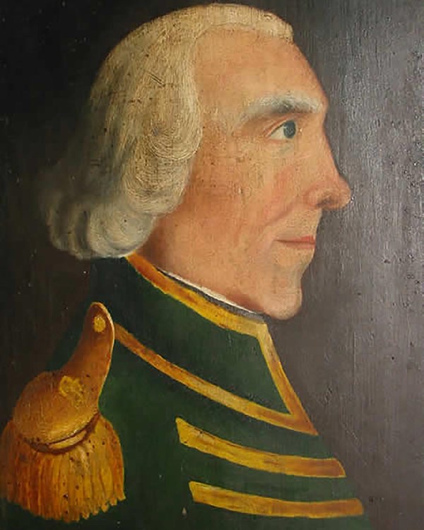 A profile portrait of an older man with white shoulder cropped hair and a pointed nose.