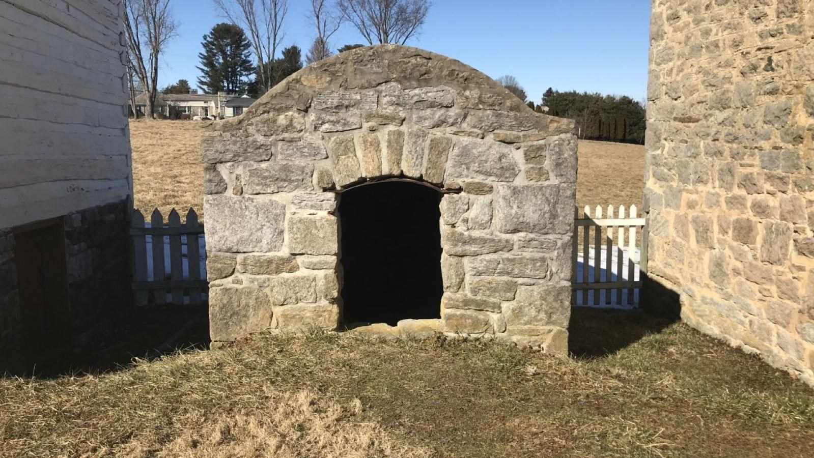 The stone ash house structure on a sunny day.