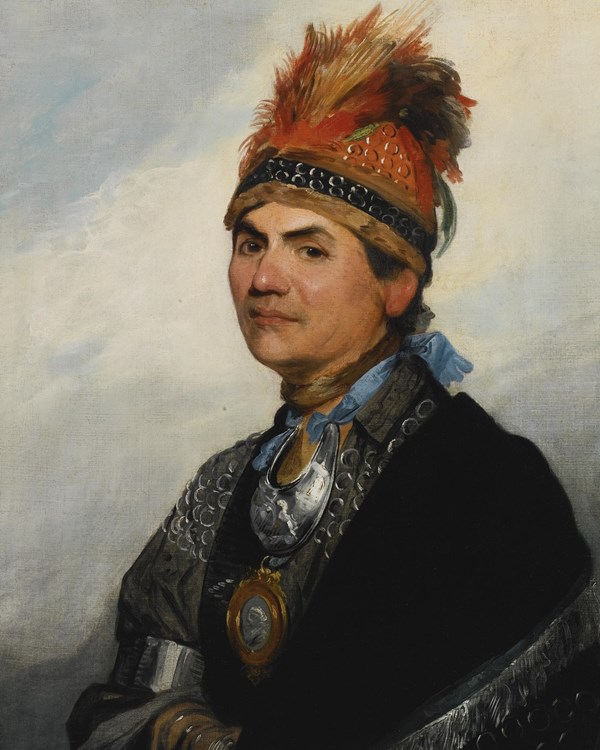 A profile portrait of a man in native garb. He wears a tuft of red feathers on his head.
