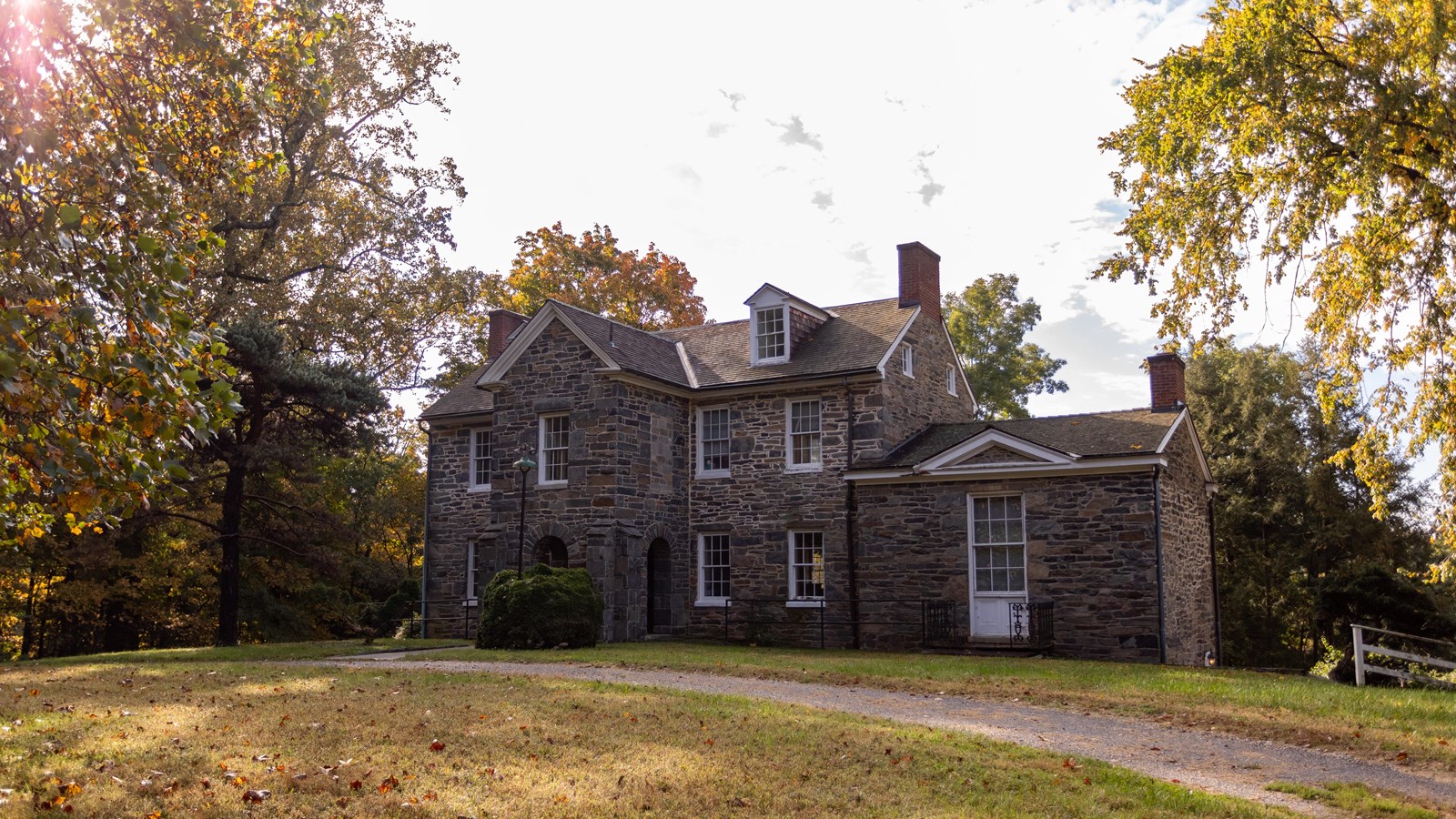 A large two story stone house 