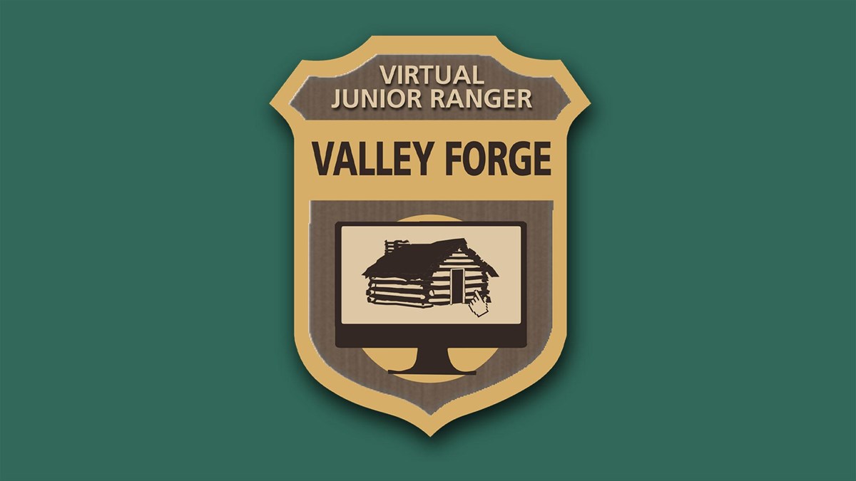 Graphic of a junior ranger badge with an illustrated log hut and computer pointer in the center