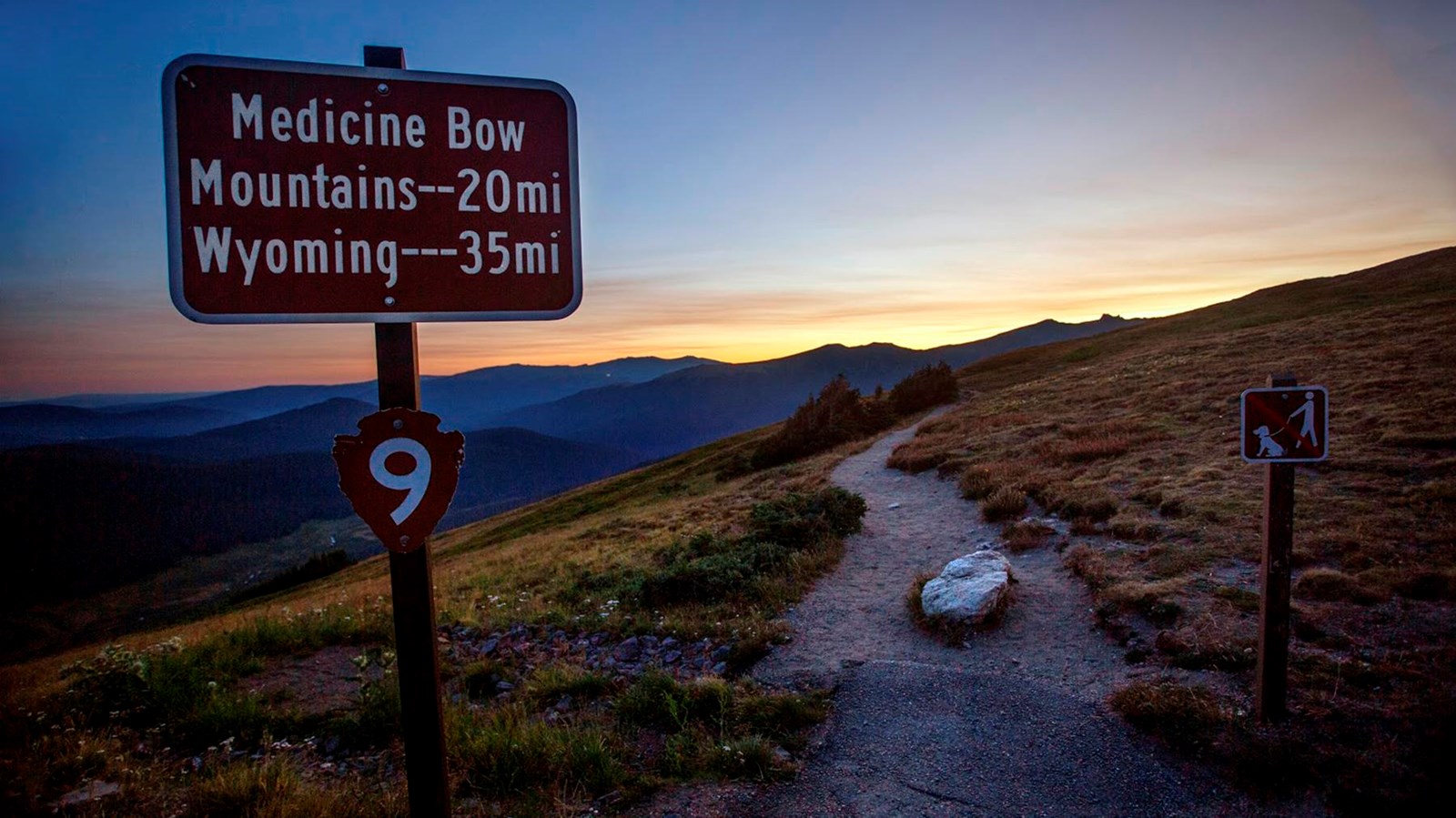 sign reads: medicine bow mountains 20 mi, wyoming 35 mi