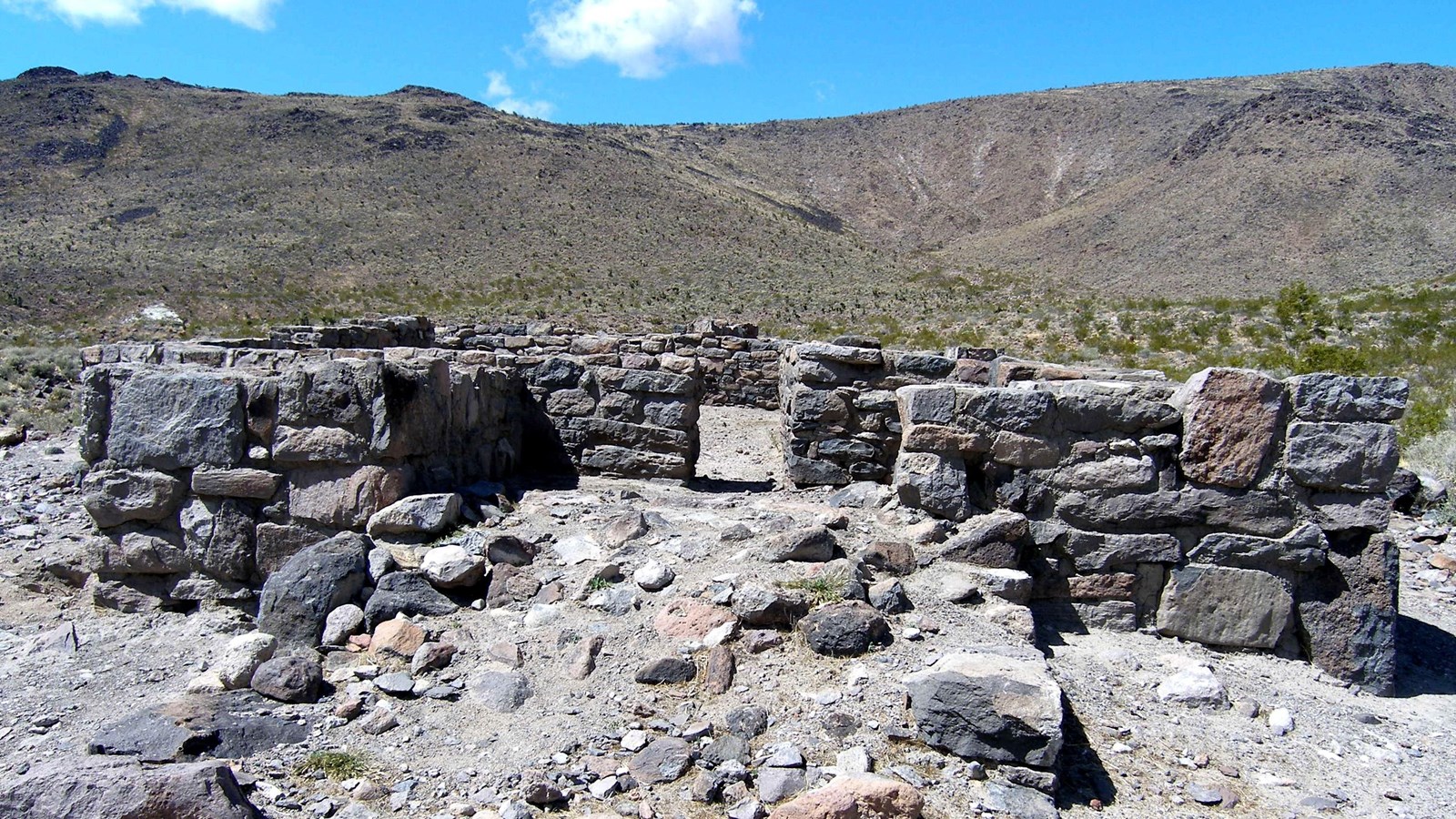 An approximately 4 foot tall structure composed completely of greyish rocks.