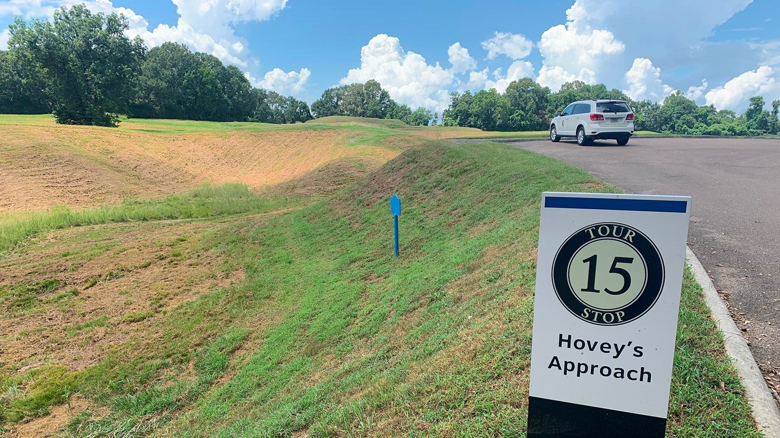A parking lot that allows visitors to look across a ravine towards the Confederate lines.