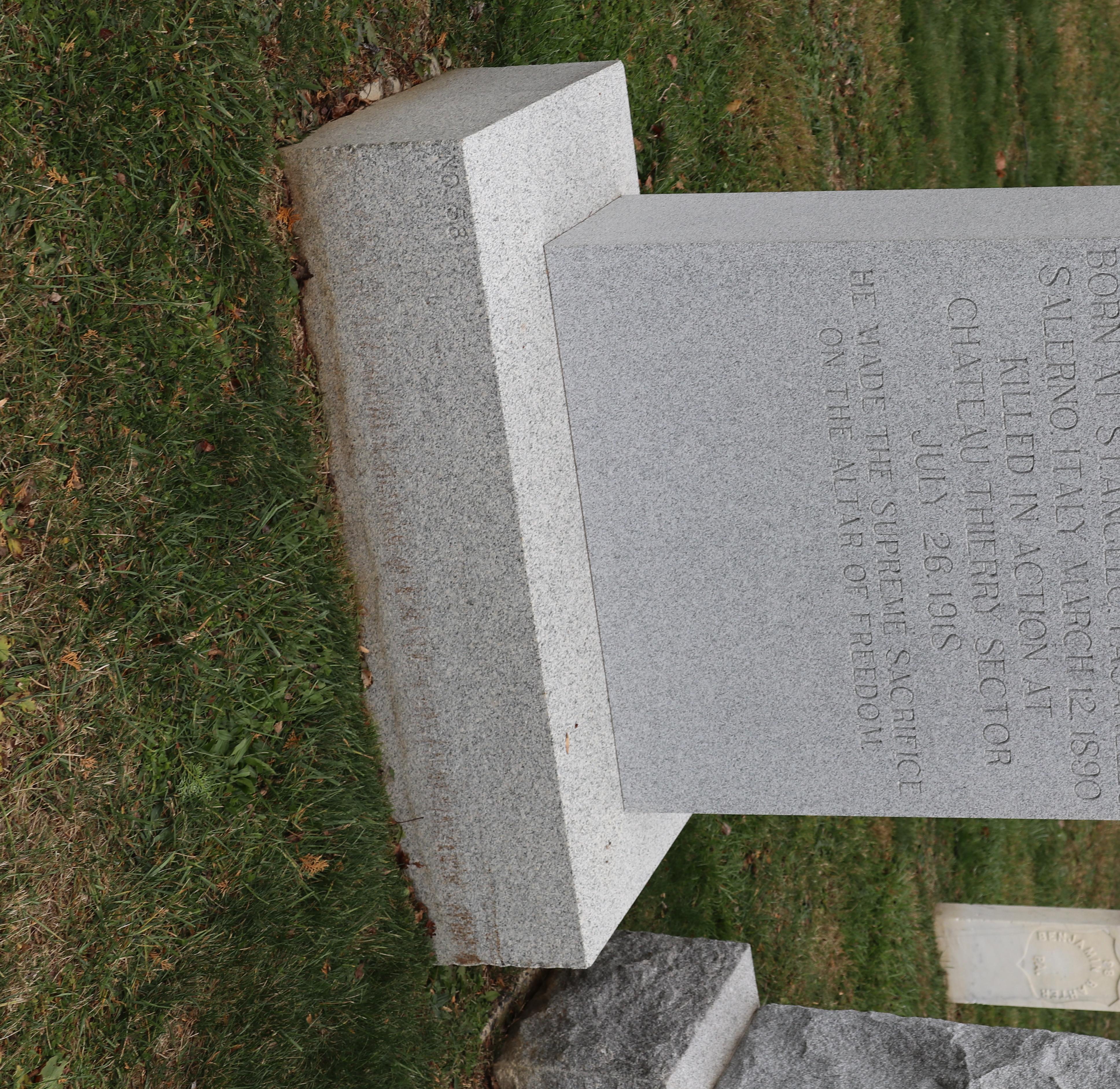 A large grey headstone for Private James Millage
