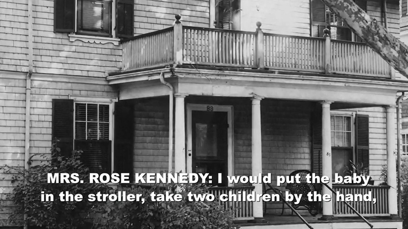 screen capture from online video showing black and white image of house