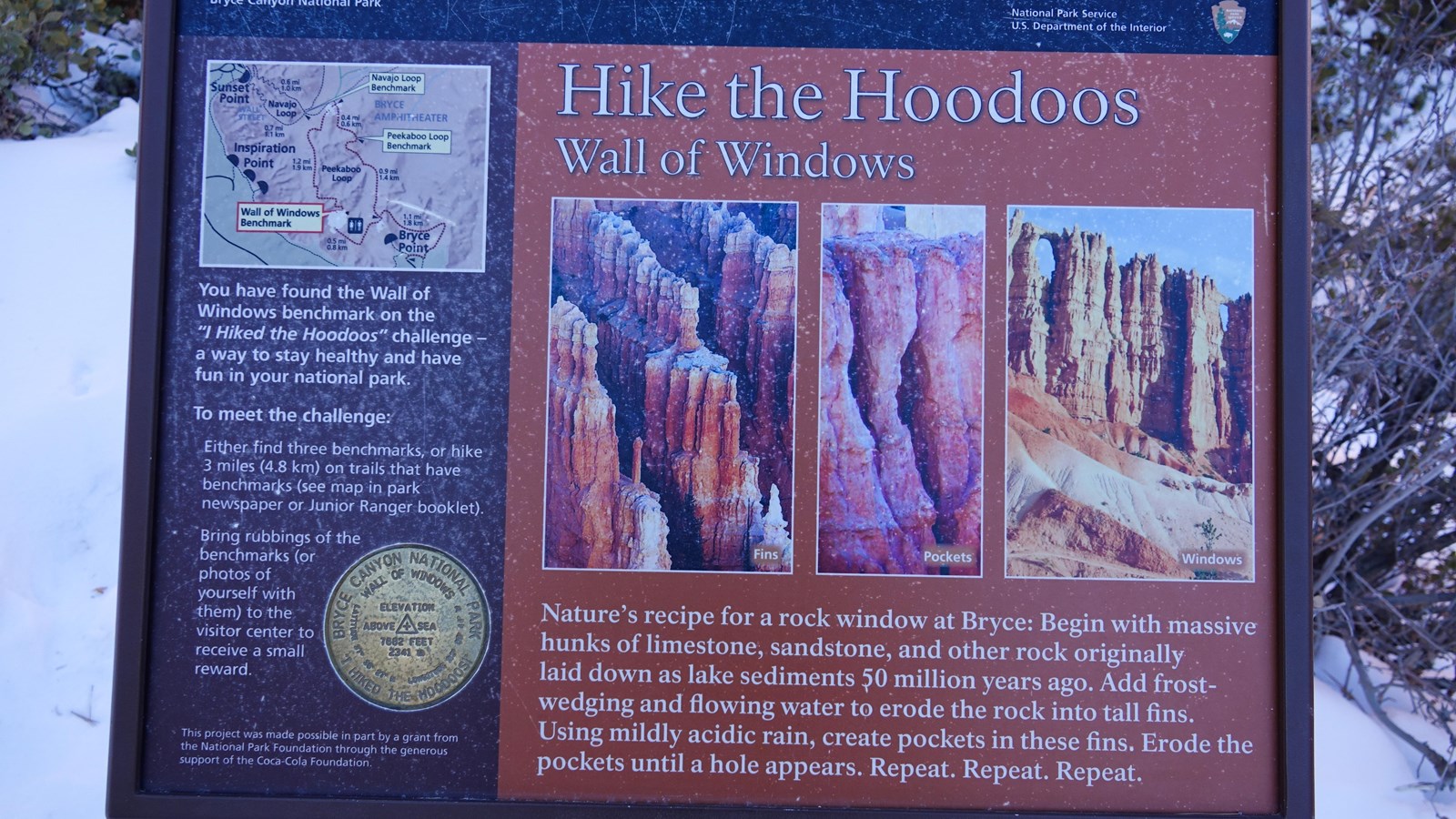 Wayside showing a wall of redrock limestone being shaped by ice also describes Hike the Hoodoos