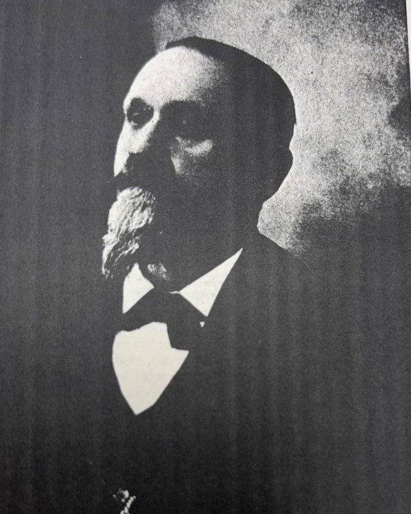 A black and white photograph of a man from the 19th century.