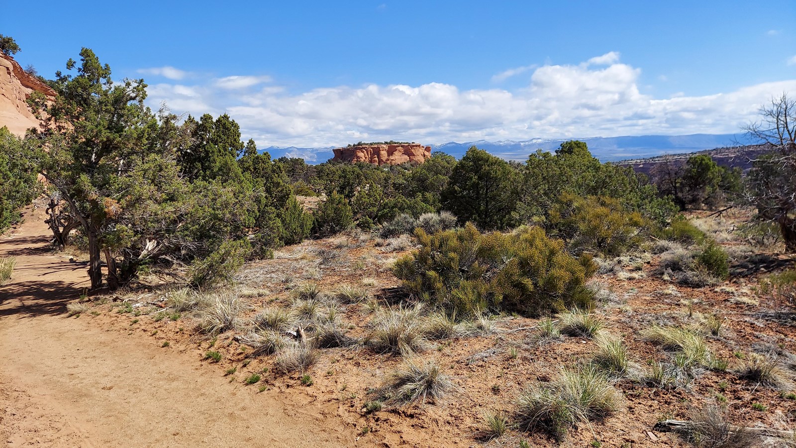 Crushed gravel path in foreground with view of monoliths in the background.