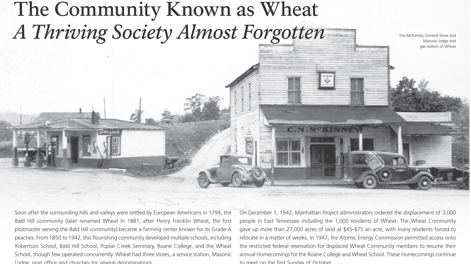 A wayside exhibit with text and a photo of a small community.