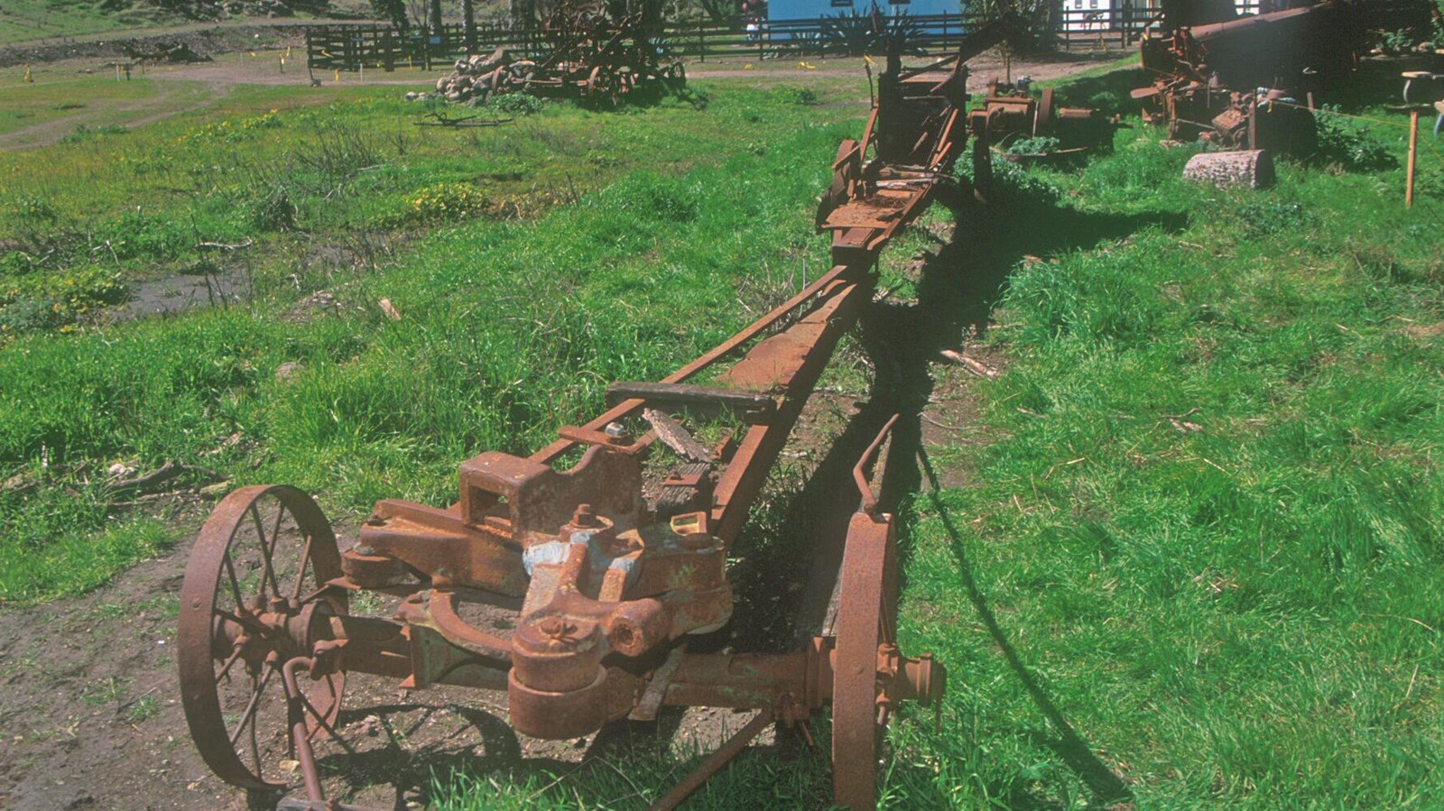 This very simple looking two wheeled cart was pulled by a horse. On the back of the flat cart is a l