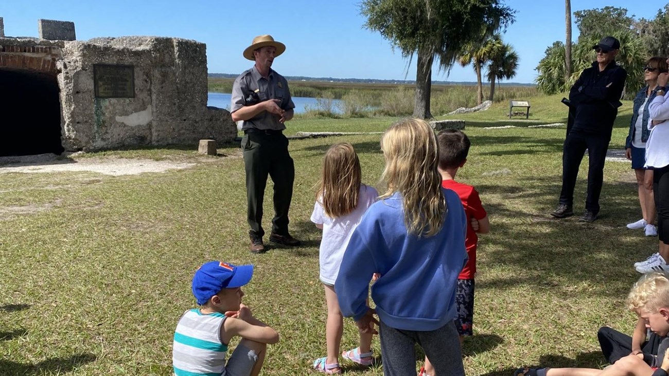 Visitors gathered with park ranger for a town tour at the Kings Magazine.