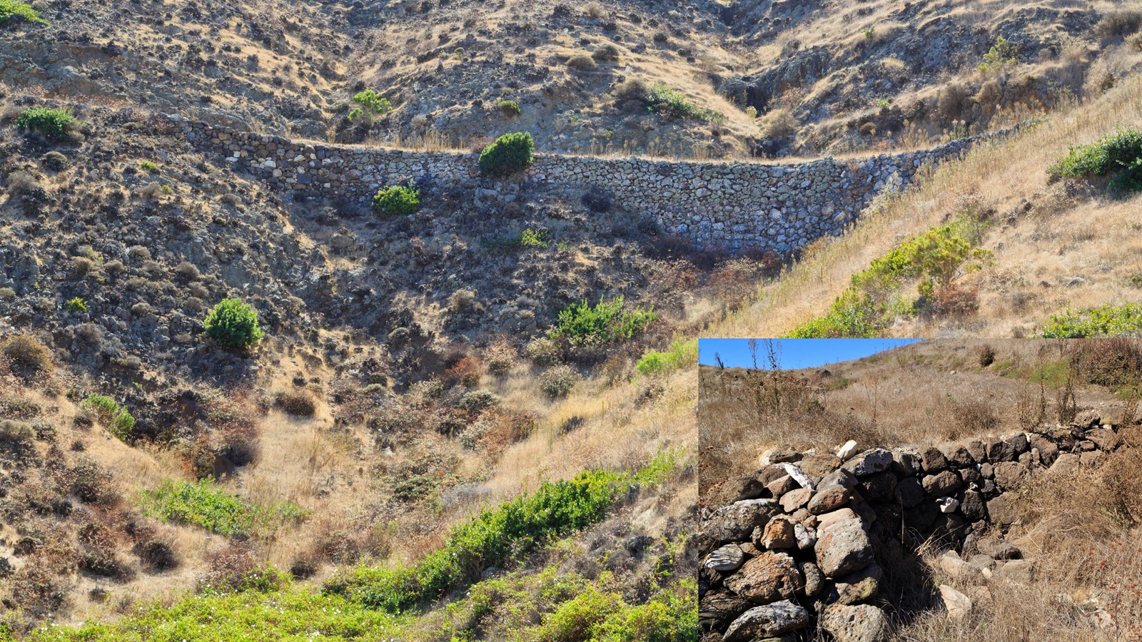 rocks piled together to create a retaining wall and dam